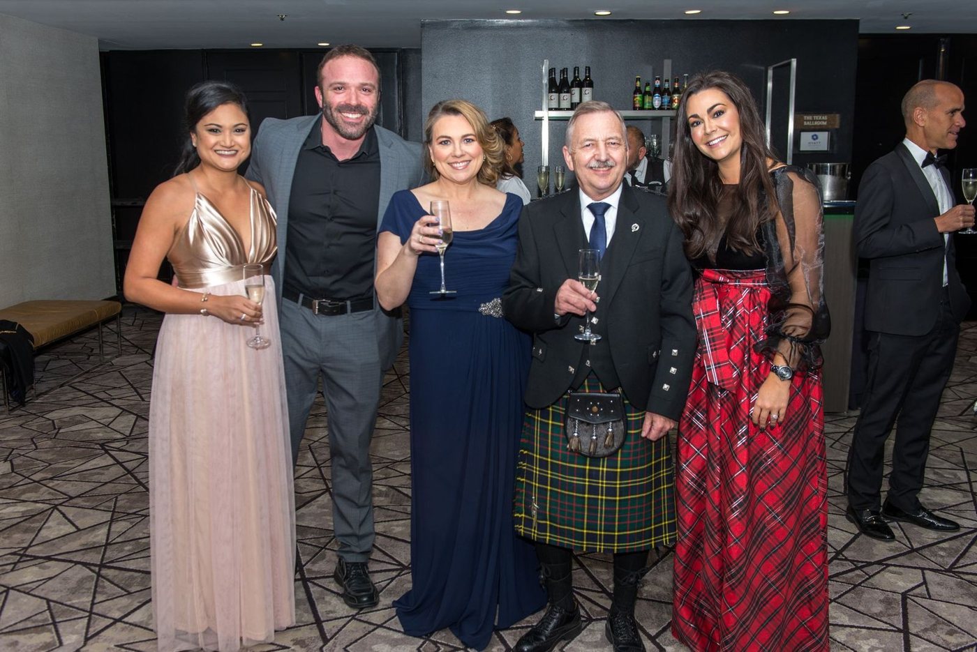 Members gathered with champagne at the reception