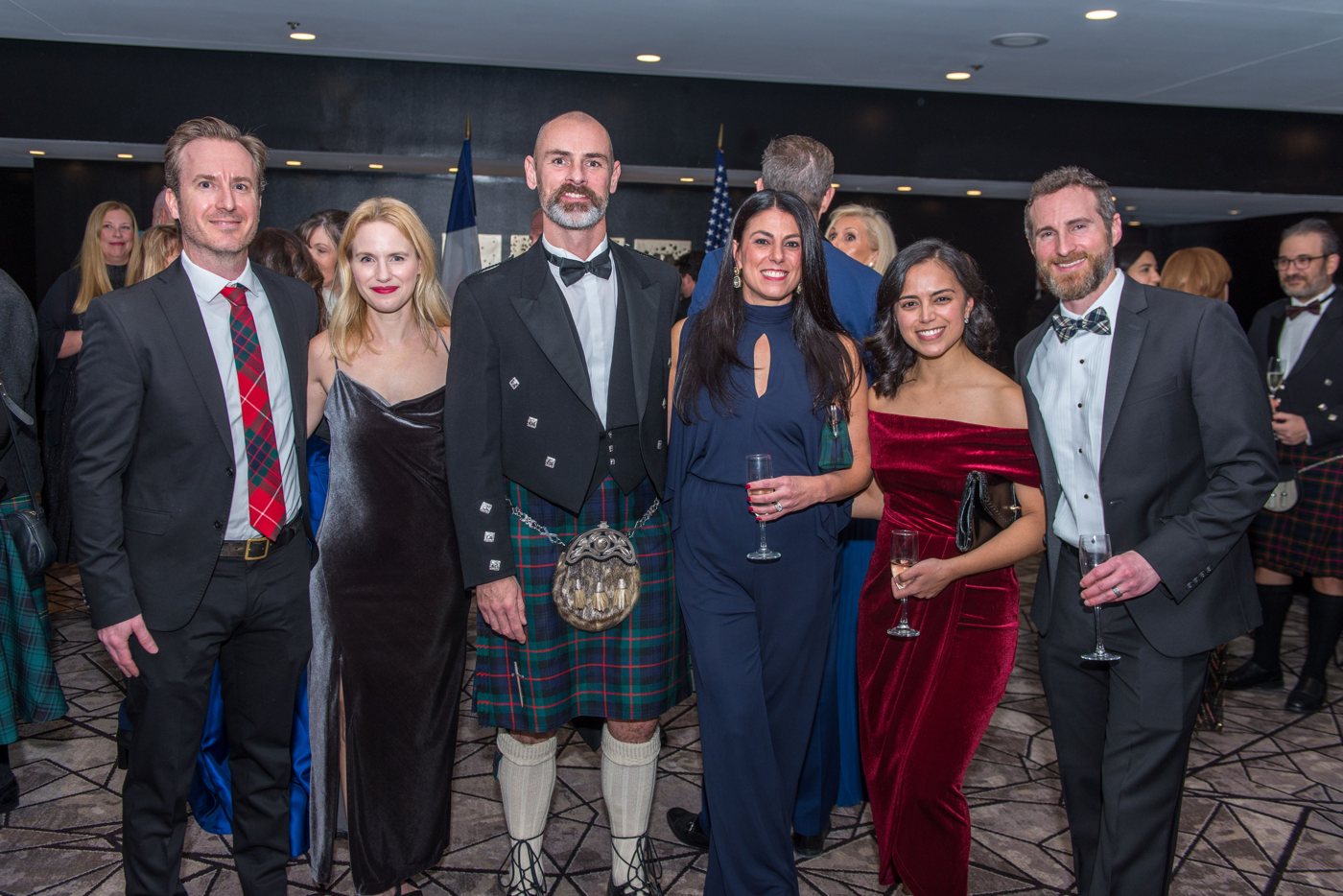 Guests in Highland dress enjoying the evening